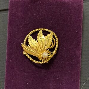 Gold toned brooch